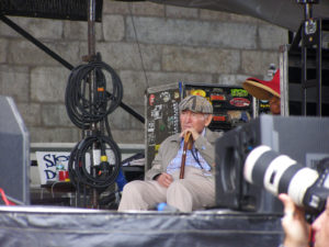George Wein watching Kamasi's band from backstage